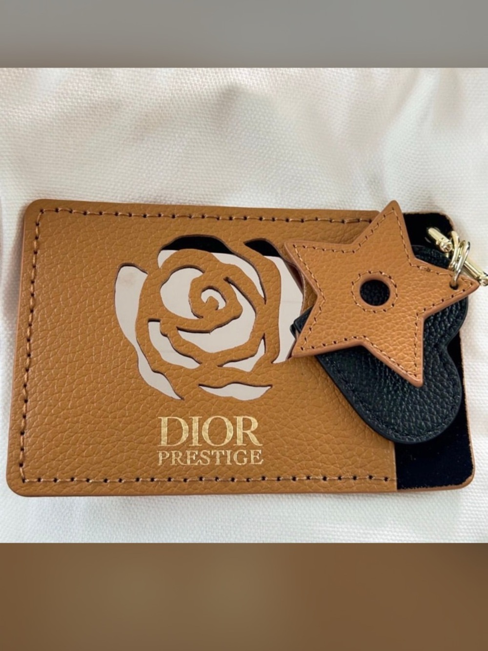 Dior Tan Leather Card Holder with Black Charm and Star Accent